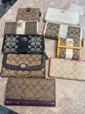 9 Coach wallets / fair condition